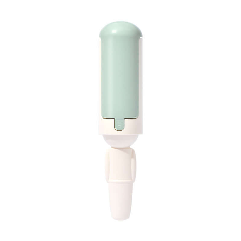 Portable pet hair roller in mint green and white for quick fur removal from various surfaces.