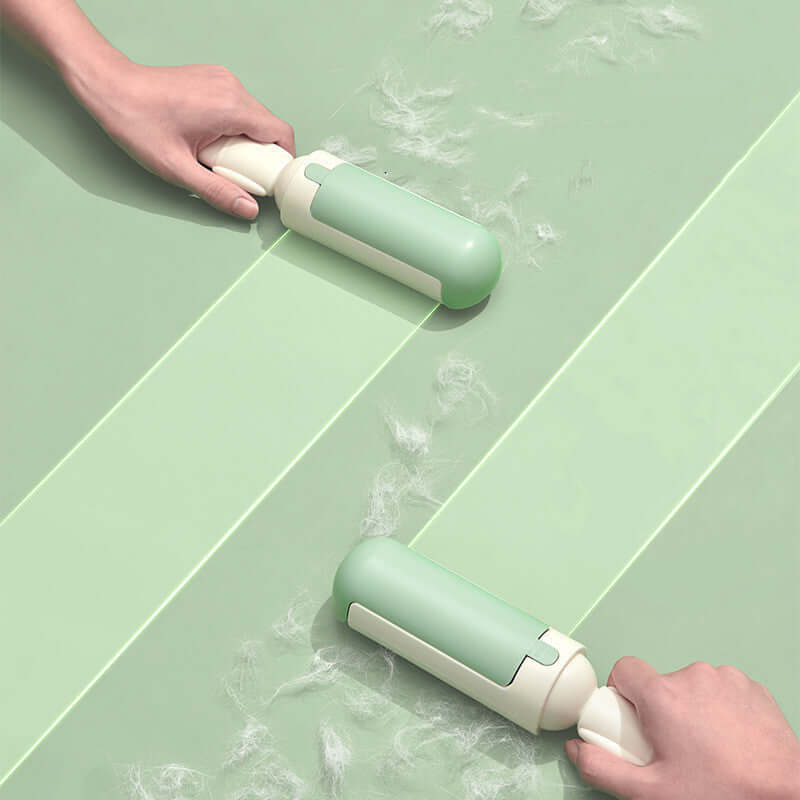 Two hands using portable pet hair rollers on a green surface to remove pet fur efficiently.