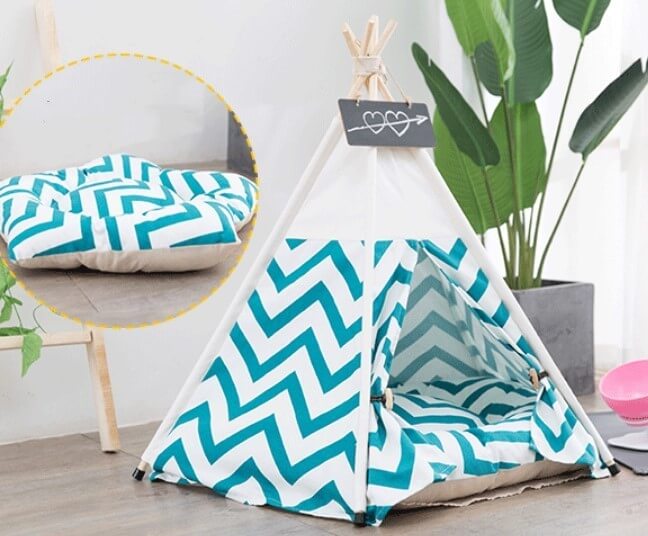 Green striped canvas tent featuring a cozy cushion, perfect for playtime and pet relaxation.