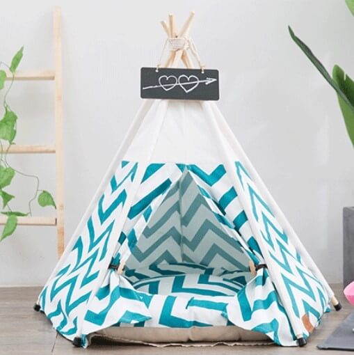 Small tent in teal chevron pattern, perfect for Pets' playroom or outdoor fun, featuring a cozy interior.
